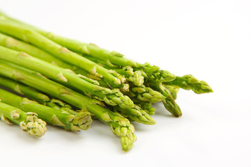 Fresh green asparagus isolated on white background