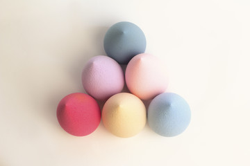 Color beauty blenders on a grey background