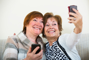 Female pensioners making selfie