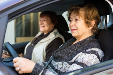 women driving in European city