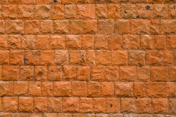 Wall of red stone, texture, background