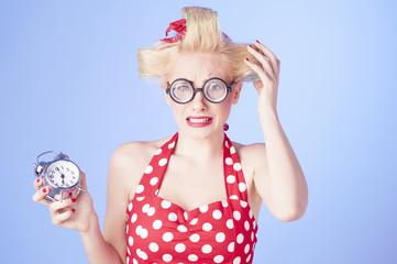 Portrait surprised business woman with alarm clock 