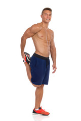 Fototapeta premium Standing Quadriceps Leg Stretches.