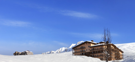 Panoramic view on hotels in winter mountains
