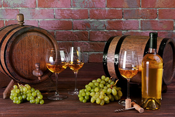 Composition of white wine on brick wall background