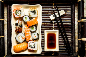 The rolls and sushi plate with soy sauce