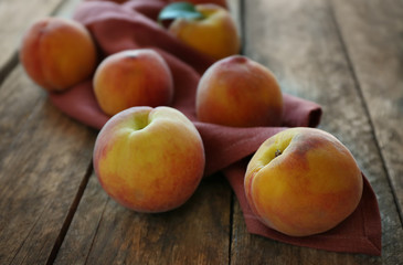 Fototapeta na wymiar Fresh peaches on a wooden background
