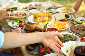 Friends eating on picnic