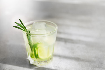 Cold fresh cocktail with lime on light background