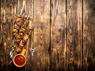 Kebab with tomato sauce.