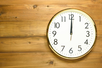 wall clock on the wooden wall