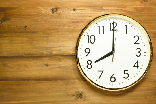 wall clock on the wooden wall
