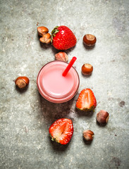 Strawberry smoothie with milk and nuts.
