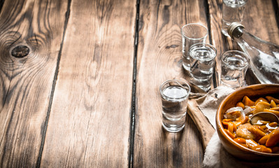 Russian style. Vodka with pickled mushrooms.