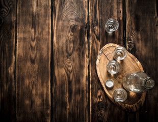 Vodka bottle with shot glasses on the Board.