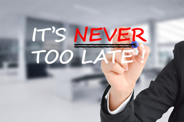 It is never too late text with businesswoman hand writing on transparent background