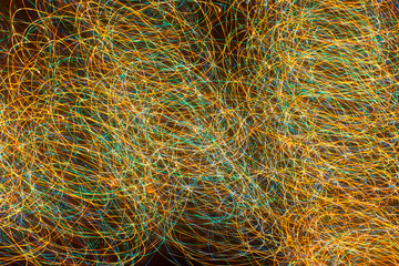 bright sparks on colorful background with bokeh effect