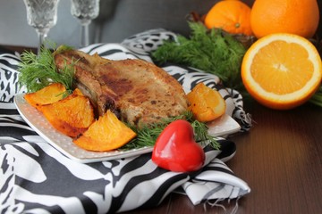 pork chop on the bone with oranges
