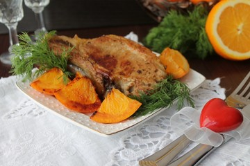 pork chop on the bone with oranges