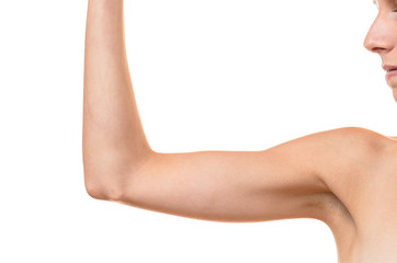 Young blond woman showing flabby arm