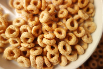 Cheerios - Bowl with cheerios whole grain cereals. 