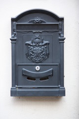Letterbox gray at house wall
