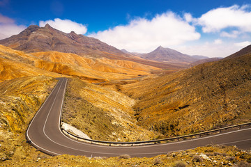 Road in vulcanic mountains near Betancuria on Fuerteventura island, Canary Islands, Spain.