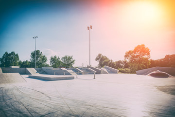 Skate Park in the daytime. Urban design concrete skatepark. - obrazy, fototapety, plakaty