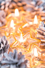 Christmas. Christmas card with glowing small candle and fir cone