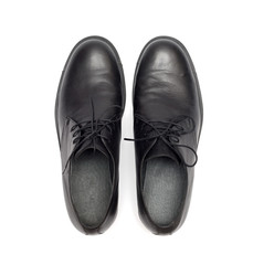 black men's shoes on a white background