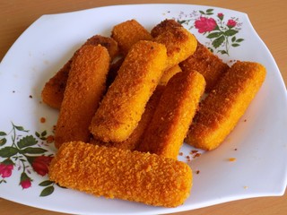 Fish fingers on plastic plate