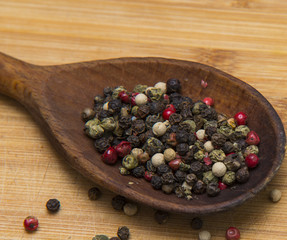 close up on mix pepper on wood