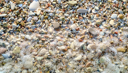 Pebbly beach and little wave background
