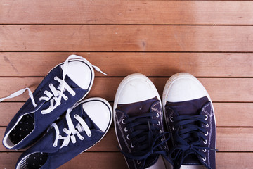 Old canvas shoes on a wooden floor