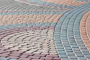 figure lined with colored stone pavement