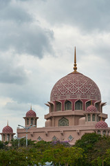 pink mosque in Putrajaya against the cloudy sky , traditional Malaysian architecture