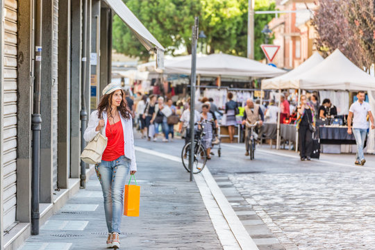 Fototapeta woman shopping in Italian street market
