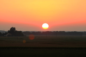 Obraz premium Sun set over the fields