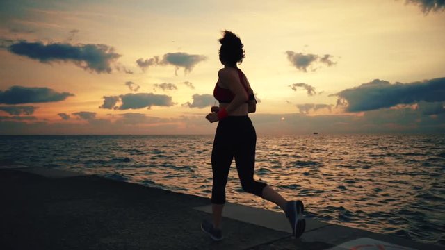 Runner athlete running at seaside
