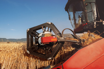 detail of a combine harvester in action