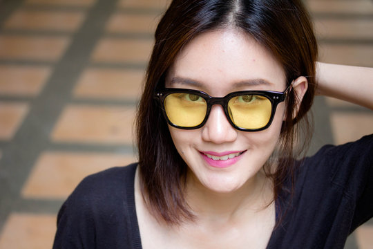 Portrait of thai adult glasses beautiful girl relax and smile