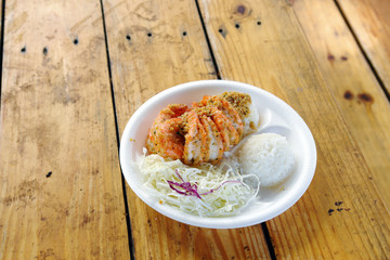 Fried shrimp of keumjimakhan with rice in white platter on woode