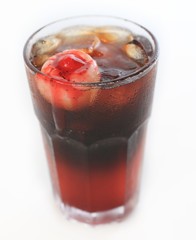 Spook Eyed Potion juice cocktail in glass with ice on white back
