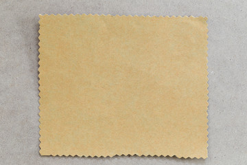 vintage of cardboard on brown background and copy specs.