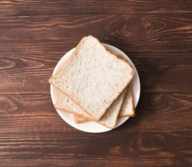 Whole wheat bread on a wood table.