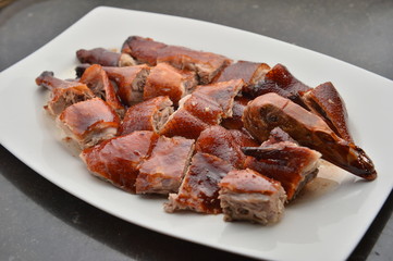 Special sliced roasted duck in Chinese style on white plate