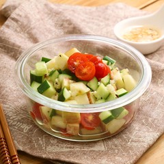 Salad of cube cucumber and tomato in plastic bowl