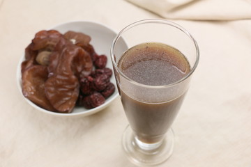 Black fungus juice in glass on the table