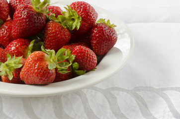 Fresh Berries in a White Bowl on White Tablecloth