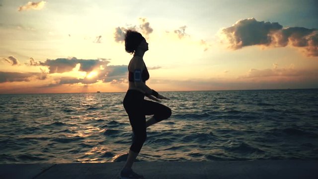 Runner athlete doing exersises at seaside